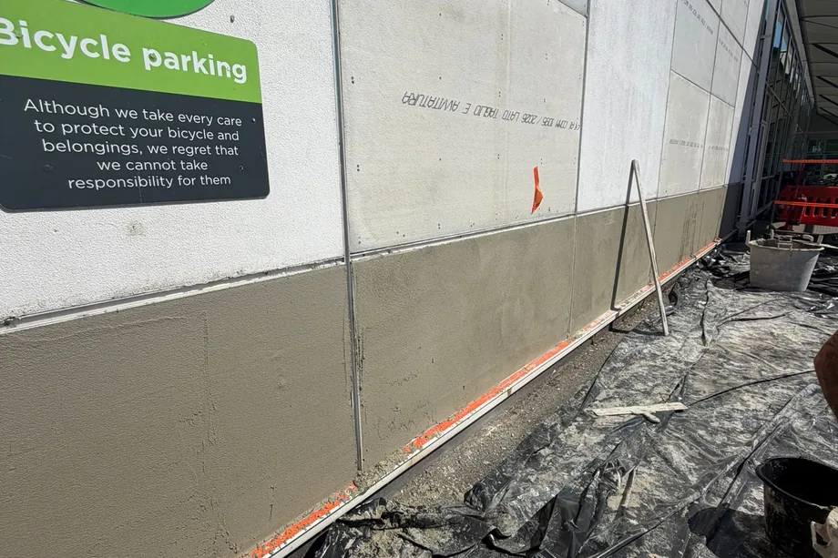 Precast wall panels on an Asda store in Bristol part-rendered, base coat and finish coat side by side