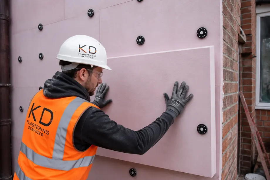 EPS insulation boards being mechanically fixed to an external wall
