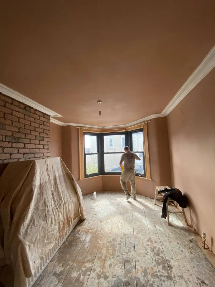 Victorian bay-window room skimmed throughout, original coving and exposed brick chimney breast